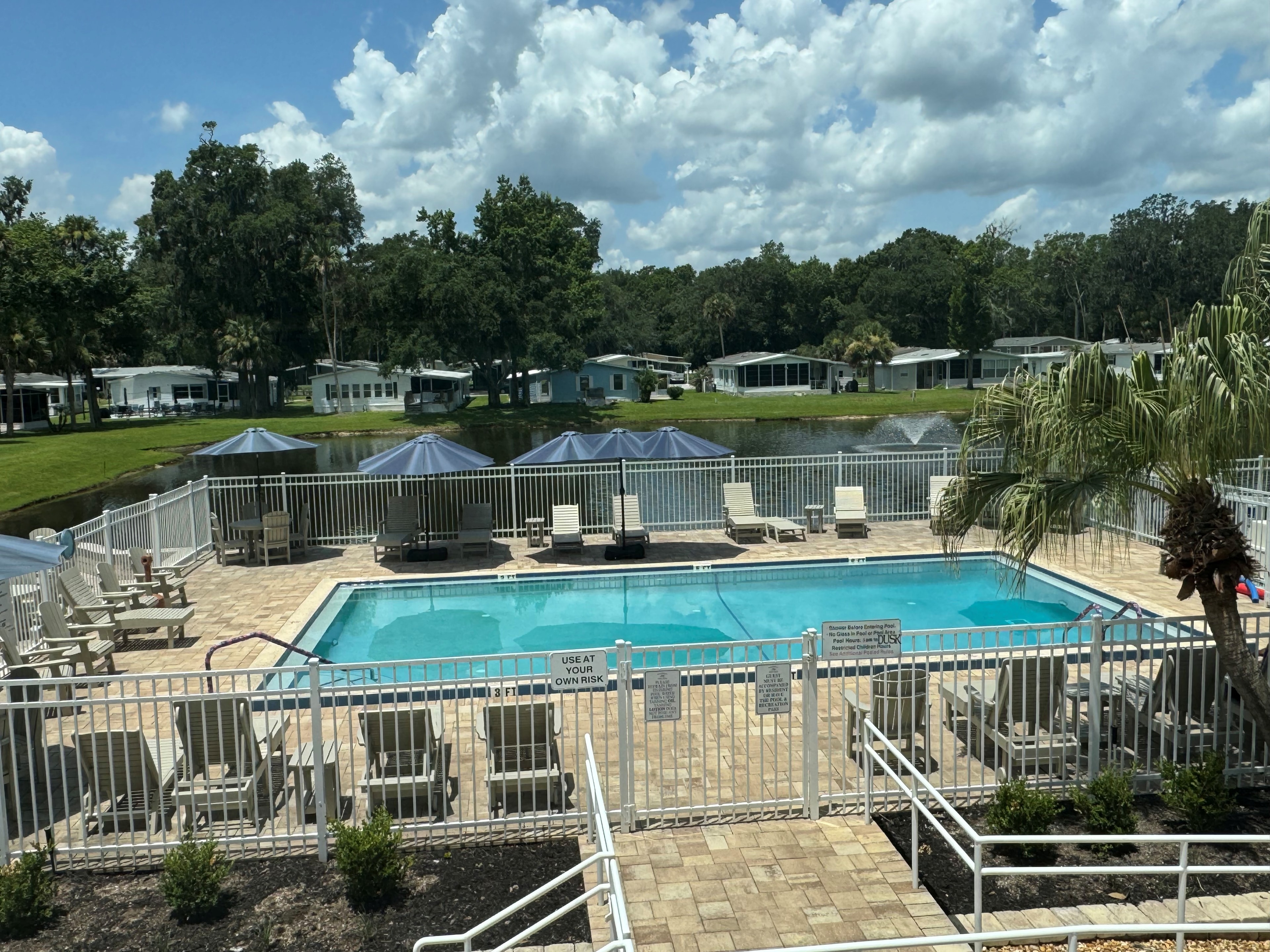 Community pool with waterfront views at Magnolia Village